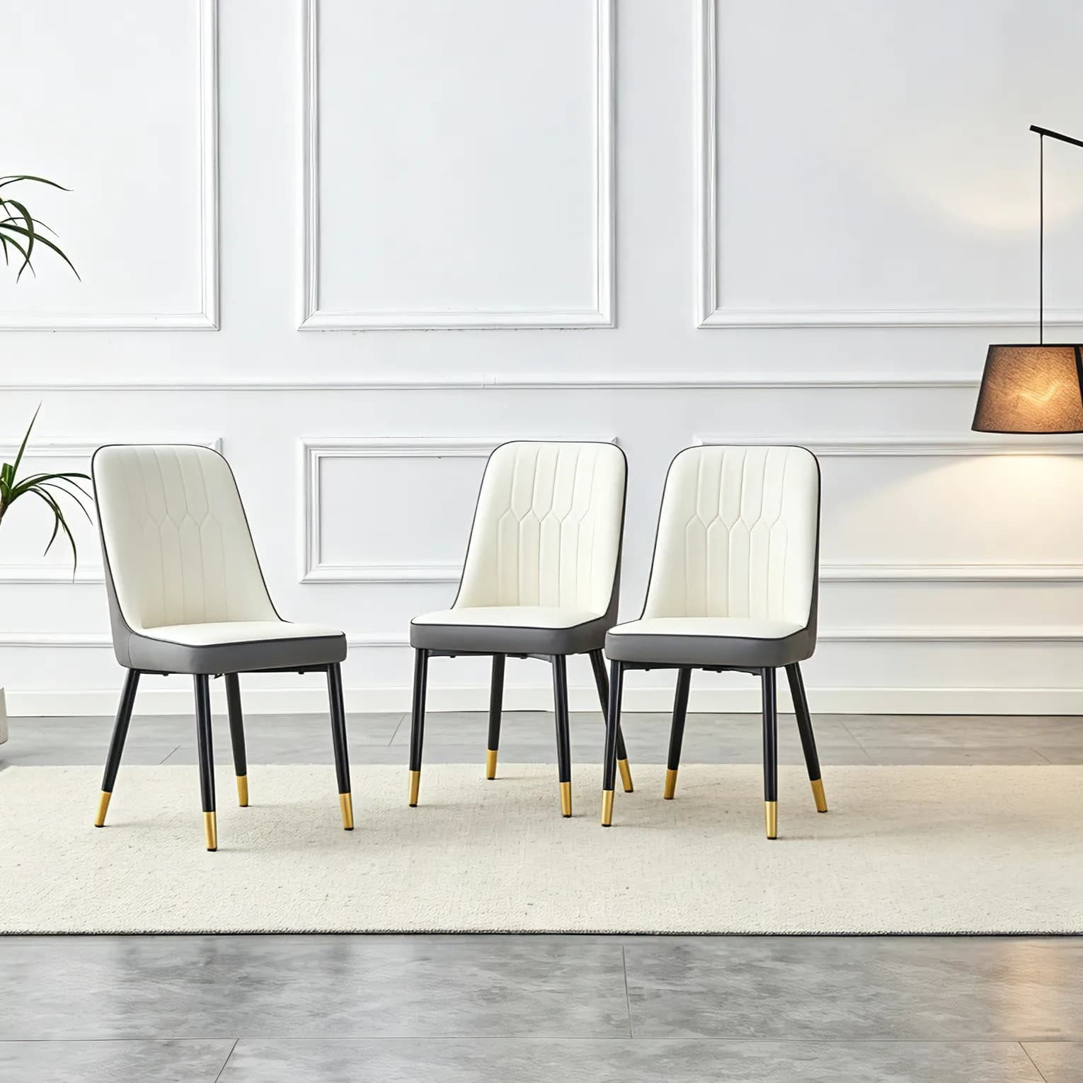 A modern dining chair with a white dark gray dual tone PU leather backrest and black…