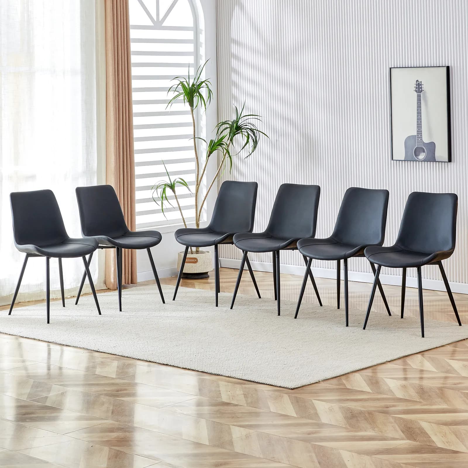 Black artificial leather backrest cushion dining chair, black metal legs, curved widened…