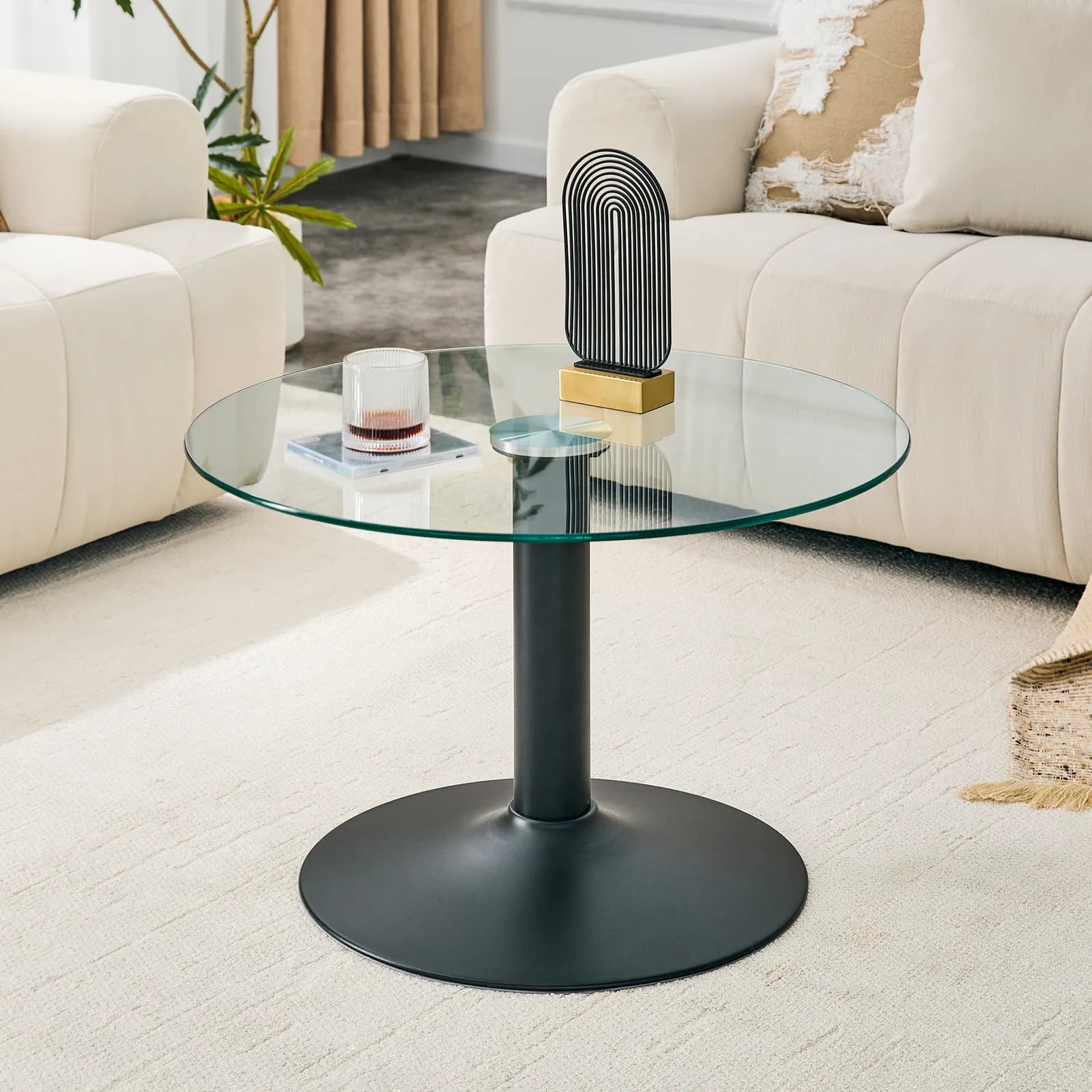 27, 5-inch diameter round tempered glass coffee table, 17, 7 inches high, supported by a…