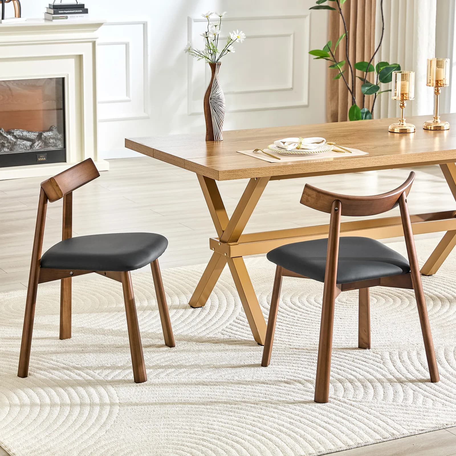 2 walnut colored solid wood dining chairs, with black PU soft cushions and curved…