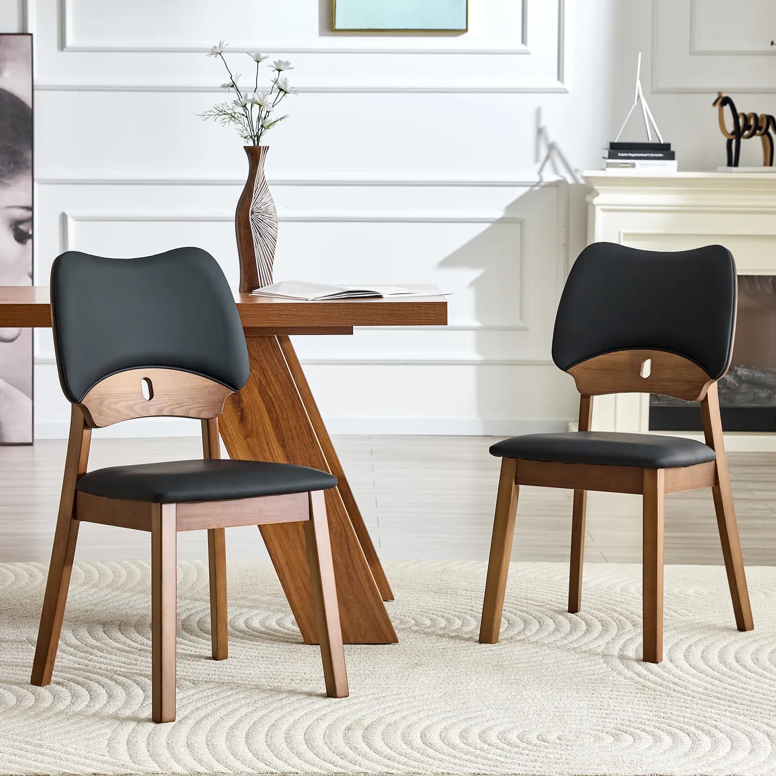 2 walnut colored solid wood dining chairs, with black PU soft packaging on the backrest…