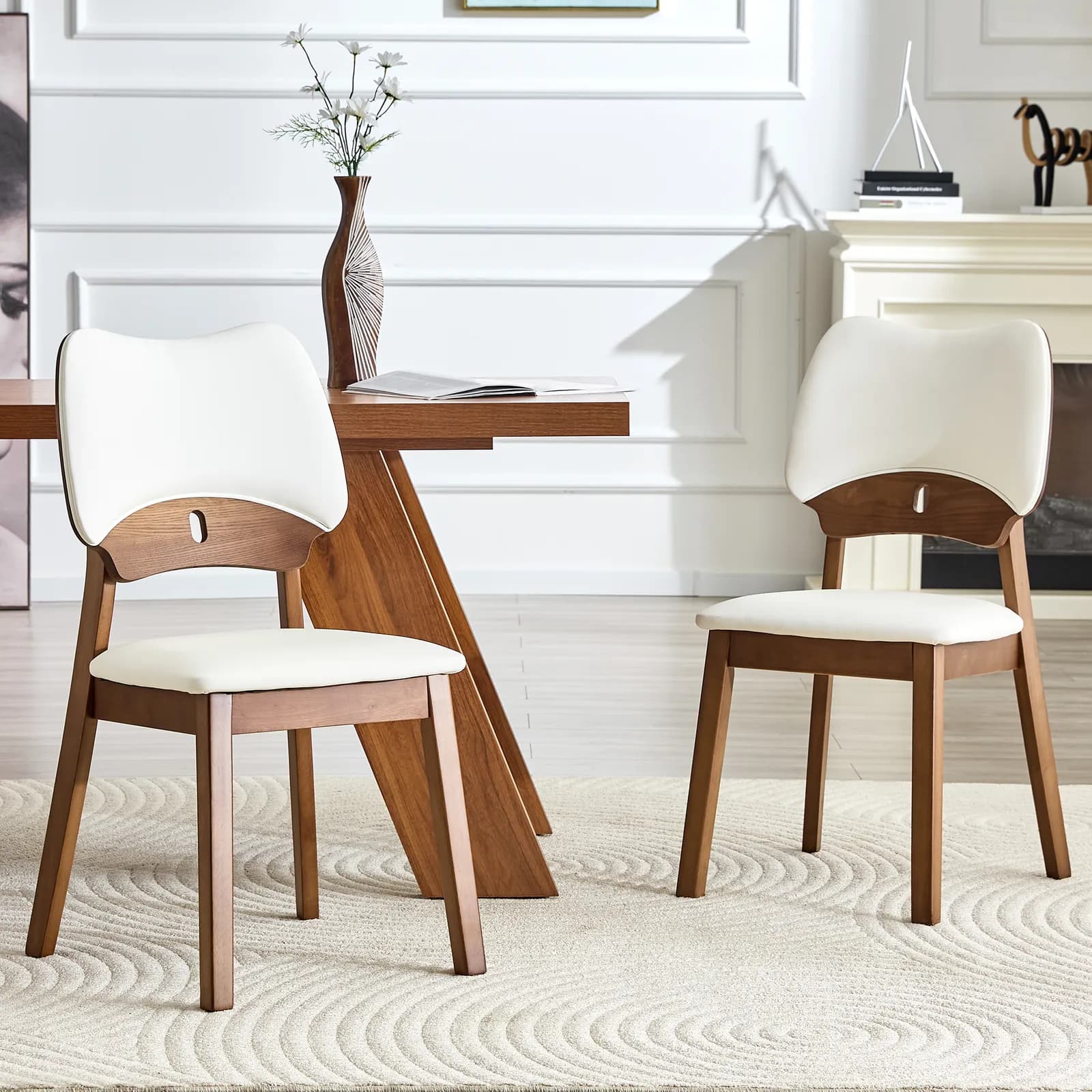 2 walnut colored solid wood dining chairs, with white PU soft packaging on the backrest…