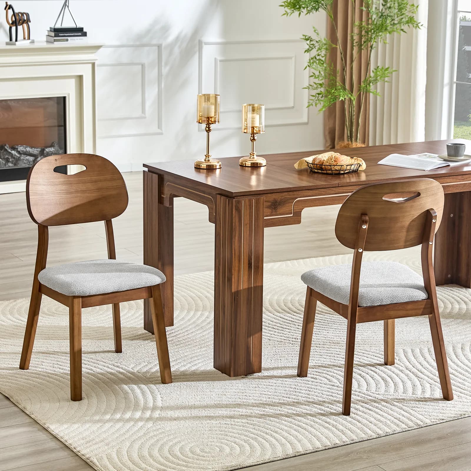 2 walnut colored solid wood dining chairs, with gray breathable fabric wrapped cushions…