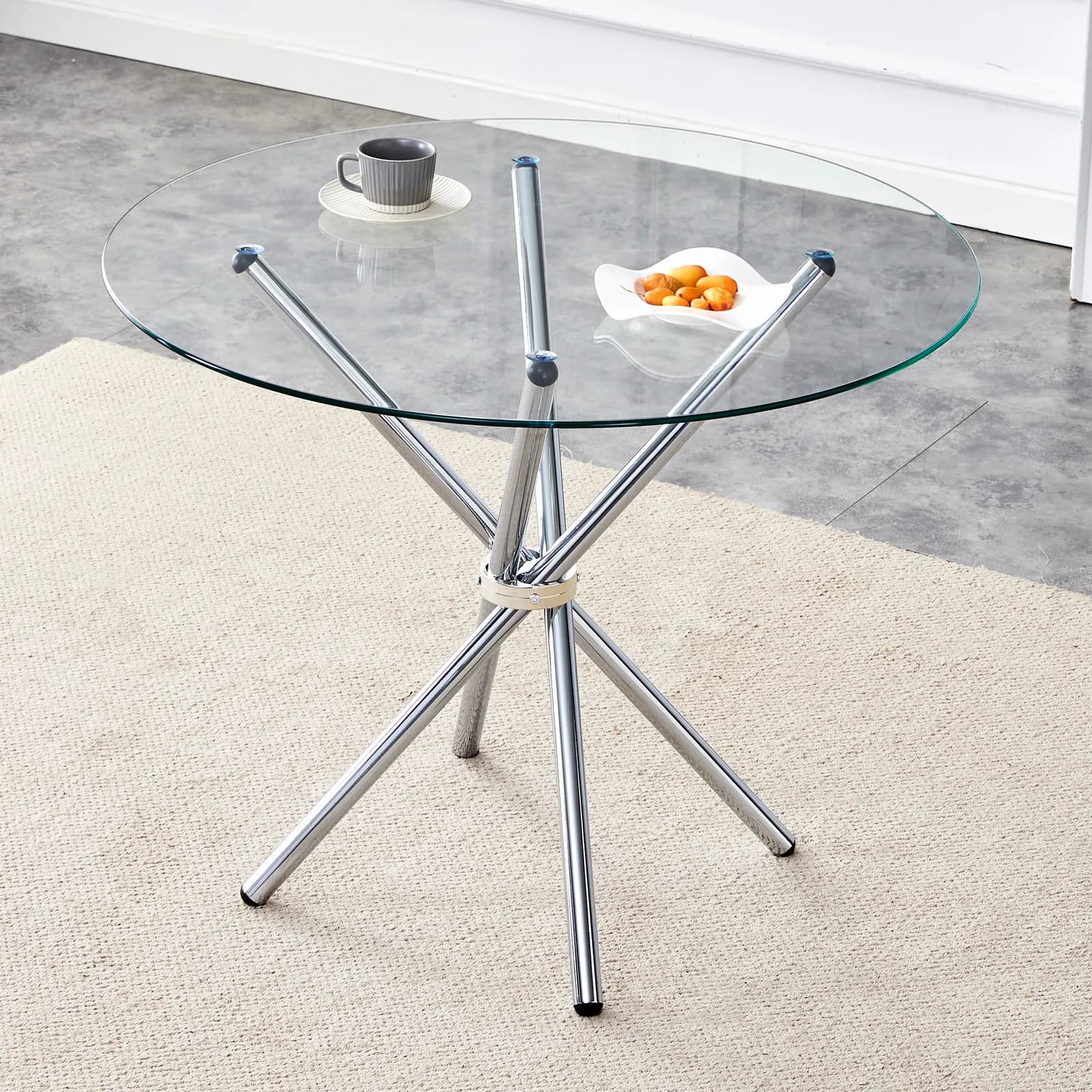 Round clear glass dining table with a unique shape for 4-6 people, with ring-shaped…