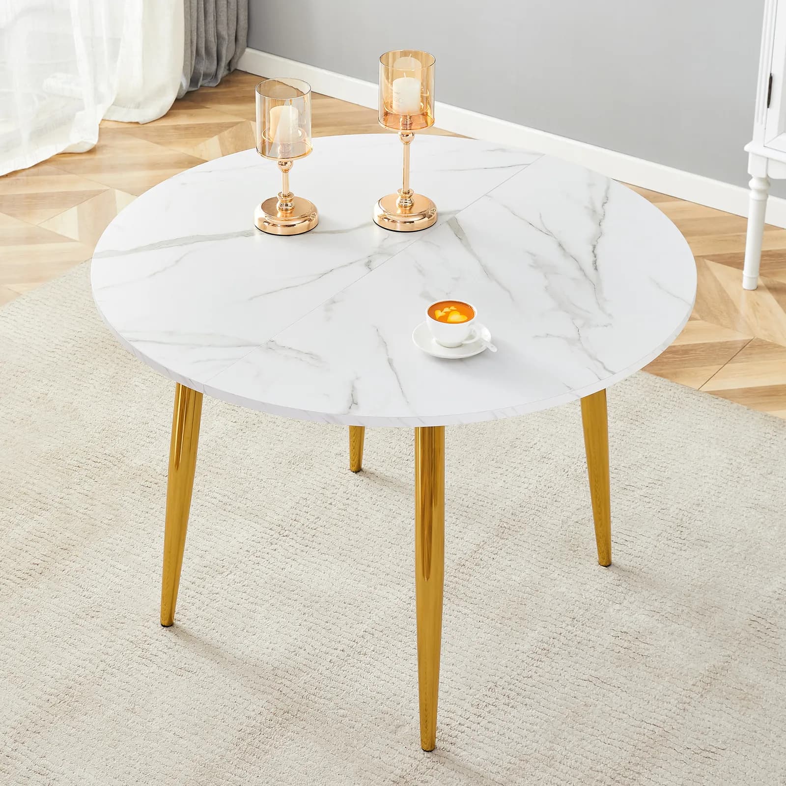 With a clever retractable mechanism, the White Pattern MDF table top and gold metal legs…