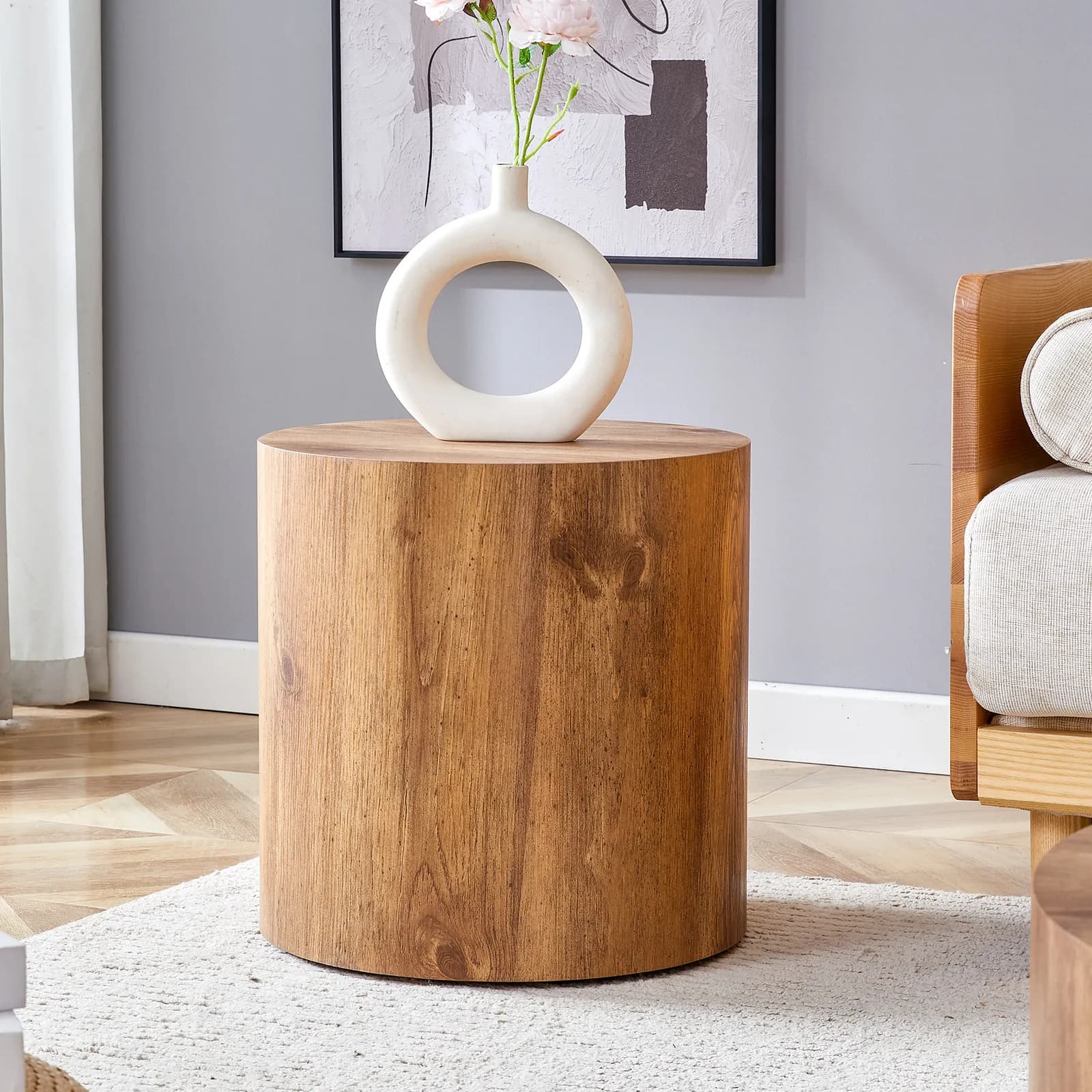 The cylindrical table with its patterned design can be easily integrated into a variety…