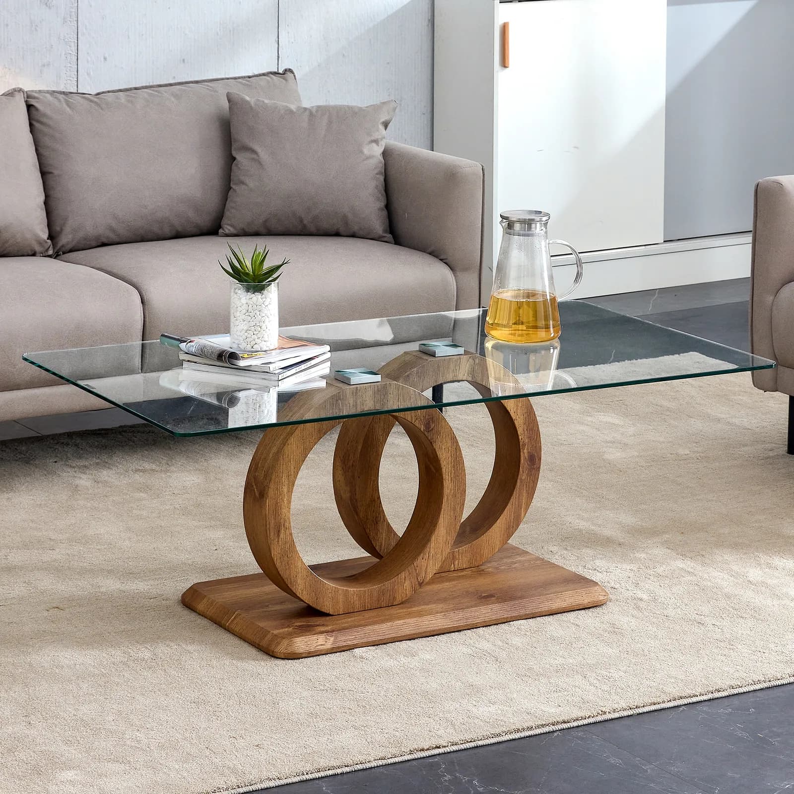 A rectangular modern and fashionable coffee table with tempered glass tabletop and wood…